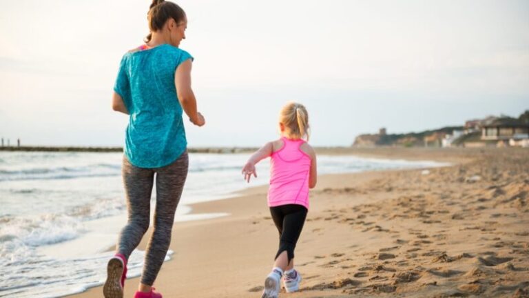 Mom and Daughter Running on Beach